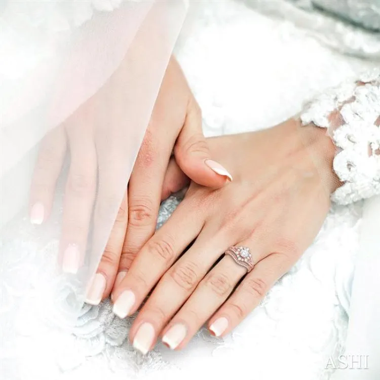 1 1/10 Ctw Diamond Wedding Set with 1 Ctw Round Cut Engagement Ring and 1/10 Ctw Wedding Band in 14K Rose Gold